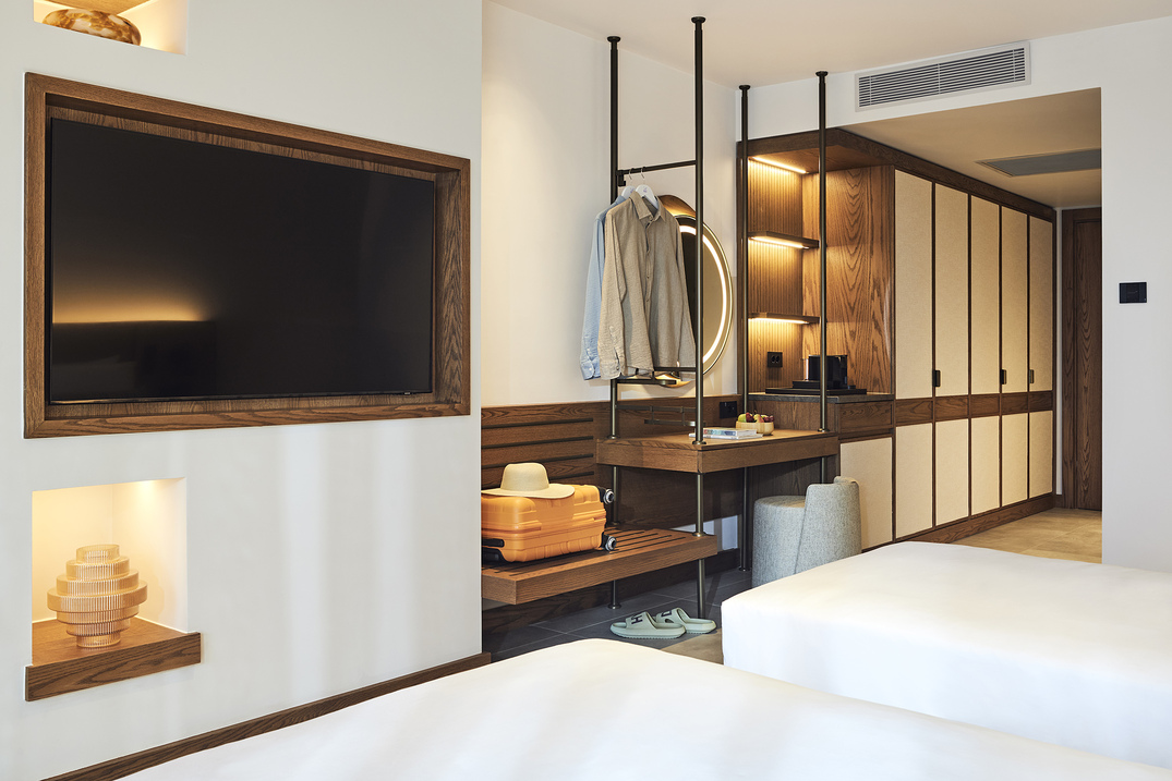 room at hyde bordum with neutral tones and big bed, window with bakcony