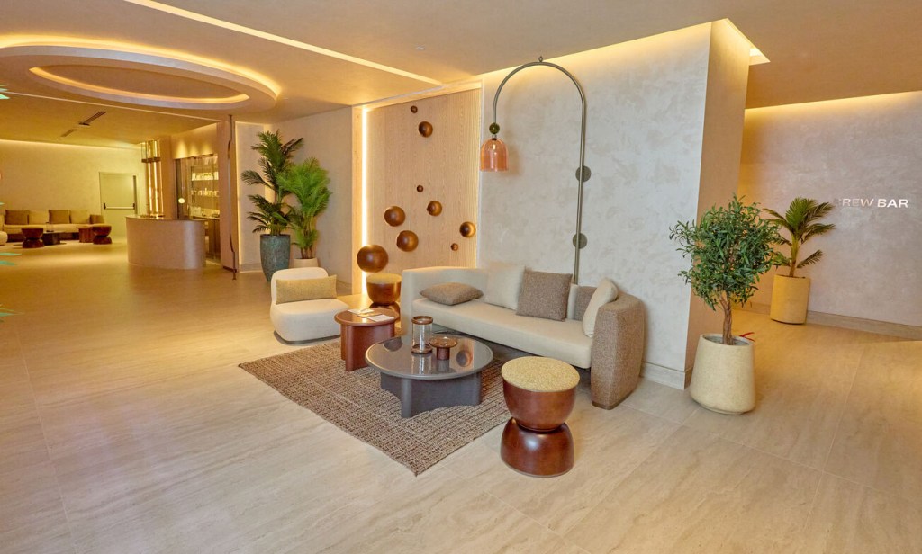 Spa at Hyde Bodrum with a sofa, chairs, decorative lighting, plants, and a minimalist reception space in the background.
