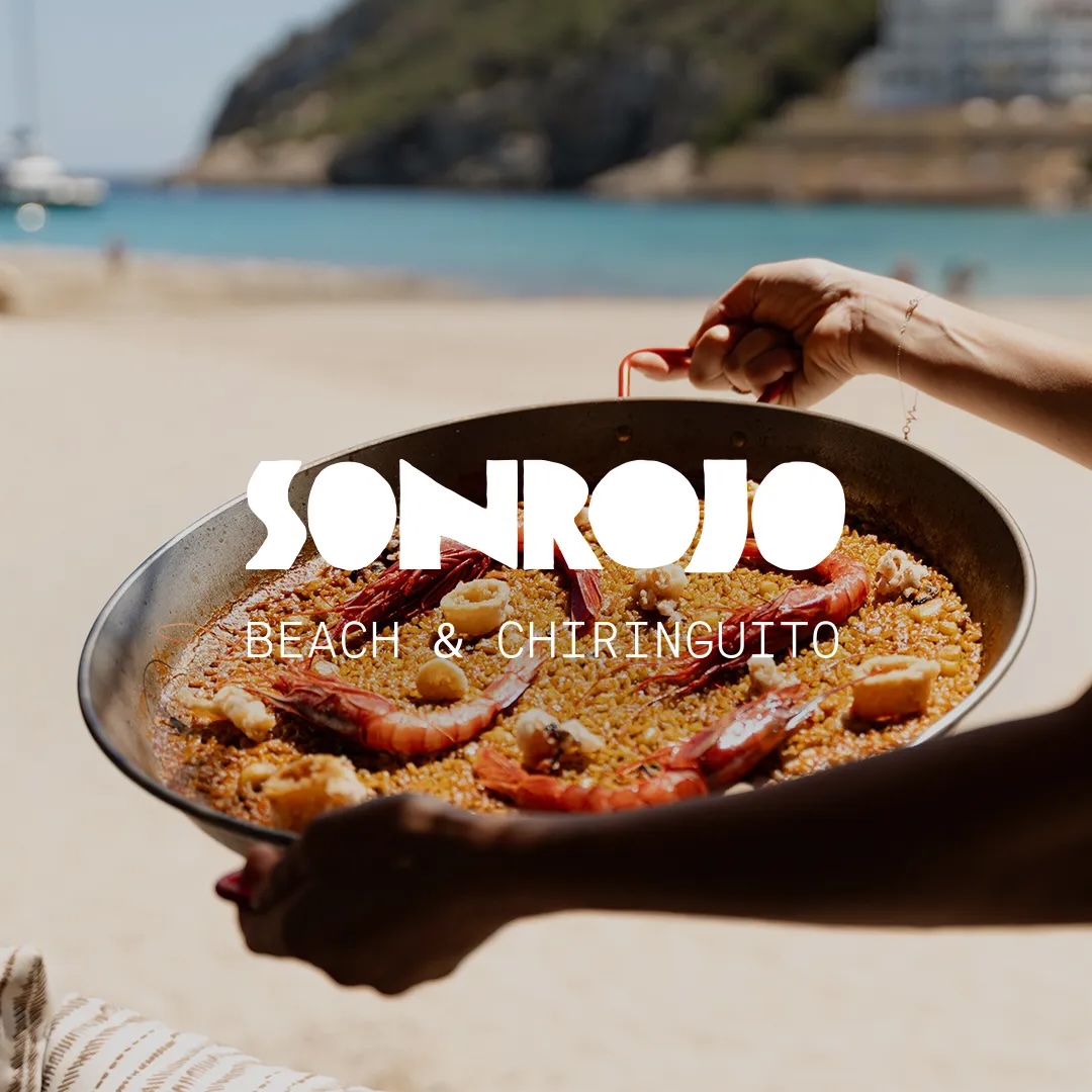 Image of a paelle served at Sonrojo with the logo over it