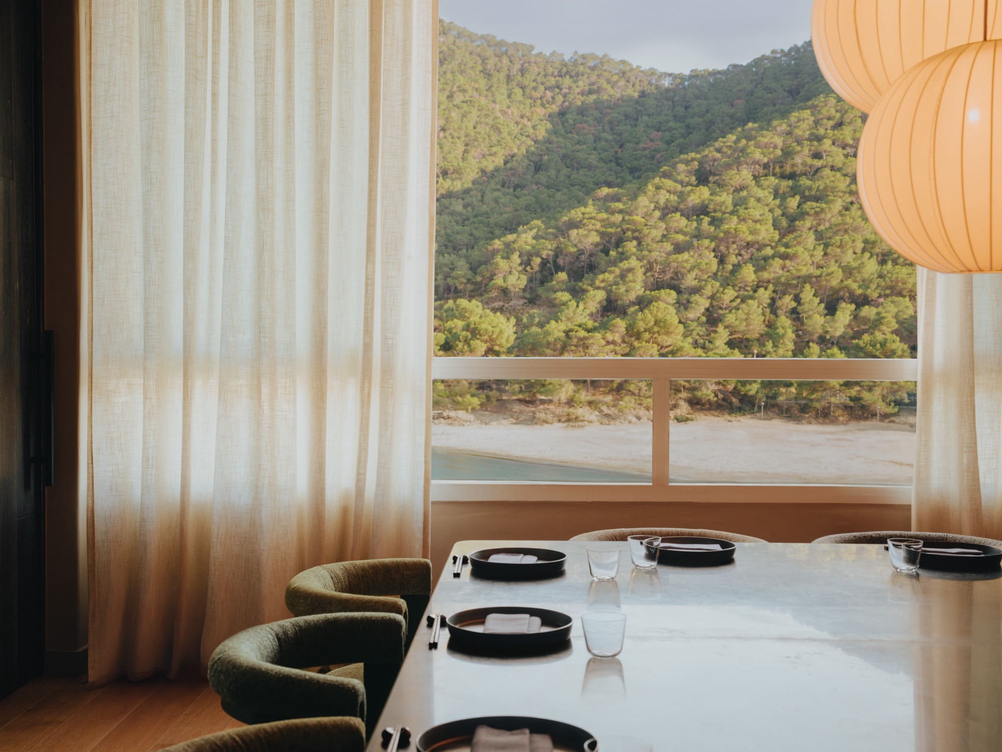 Restaurant table inside with outside view showing in the background