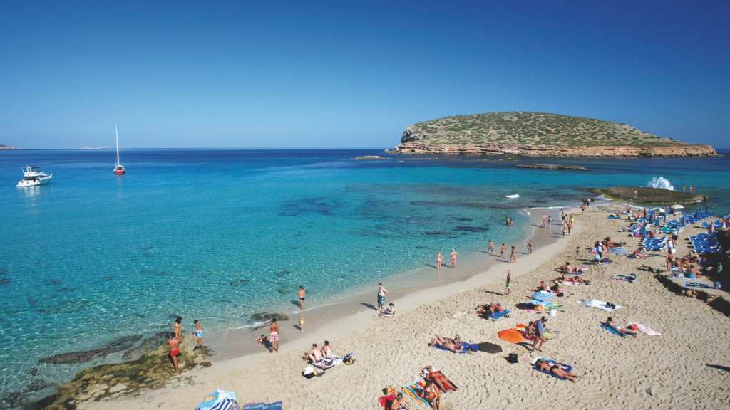 View of a beach with people having fun on it