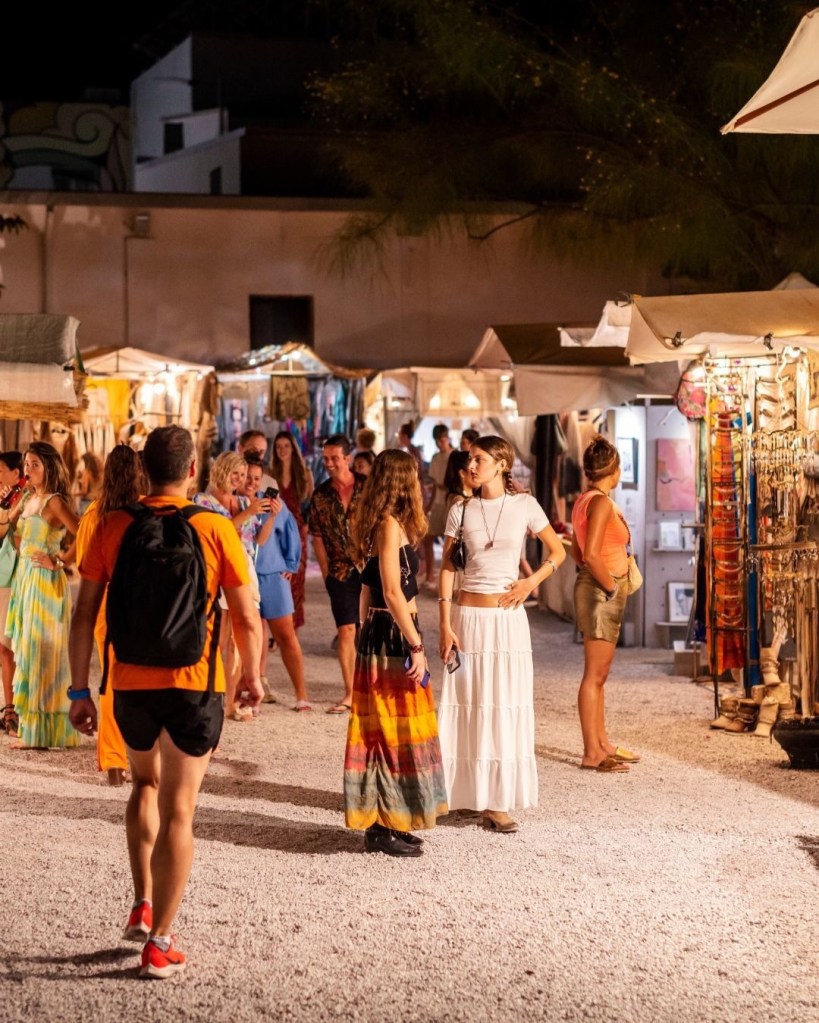 People walking around a hippy market in Ibiza