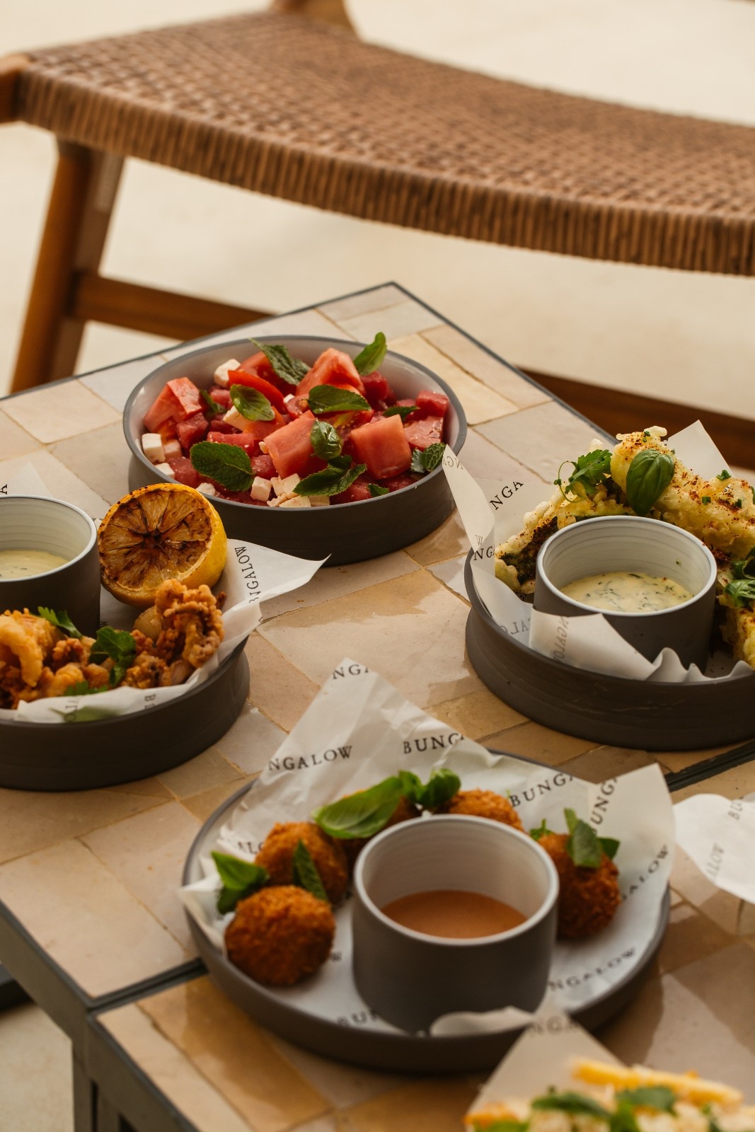 multiple dishes from Bungalow on a table