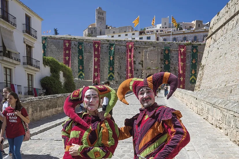 2 people posing for a picture in customes