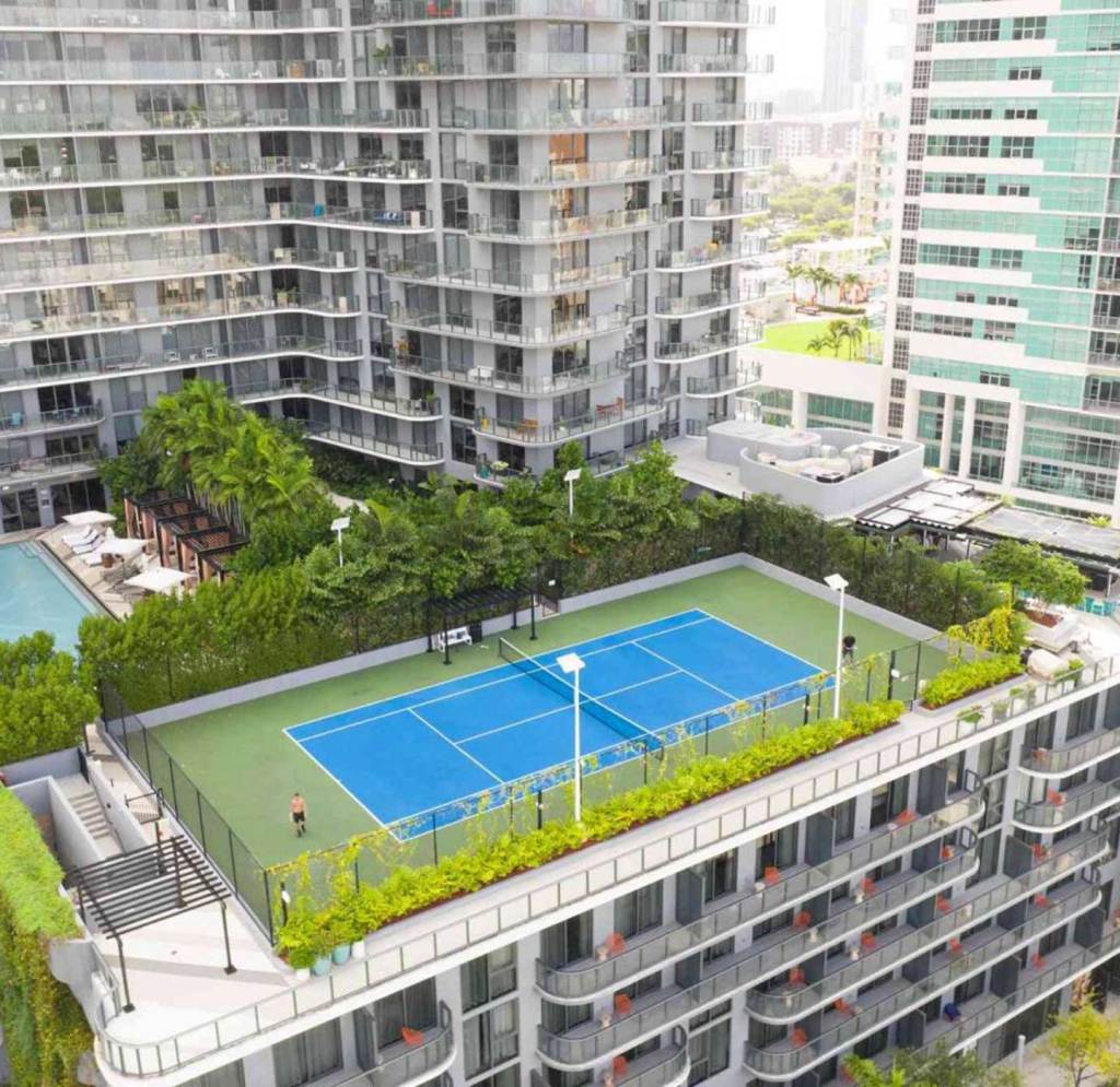 A rooftop tennis court on top of the Midtown Miami hotel