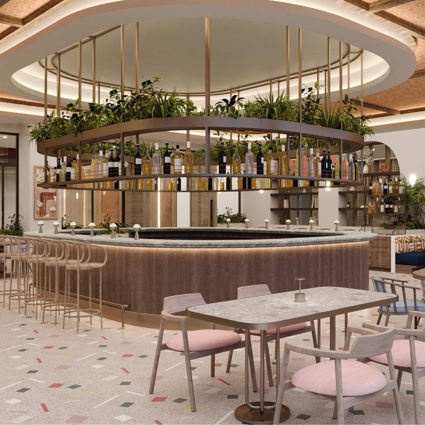 Brass oval bar with lots of greenery, light brown barstools, and marble table with pink chairs, floor with an abstract colorful design