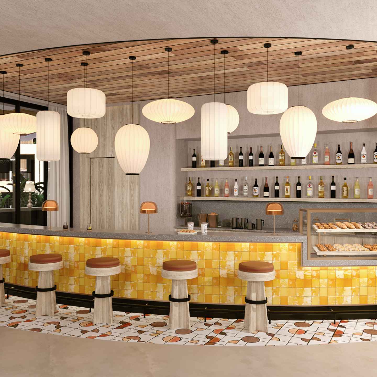 Bar with yellow tile, various shaped hanging lights, round barstools, and pastry case