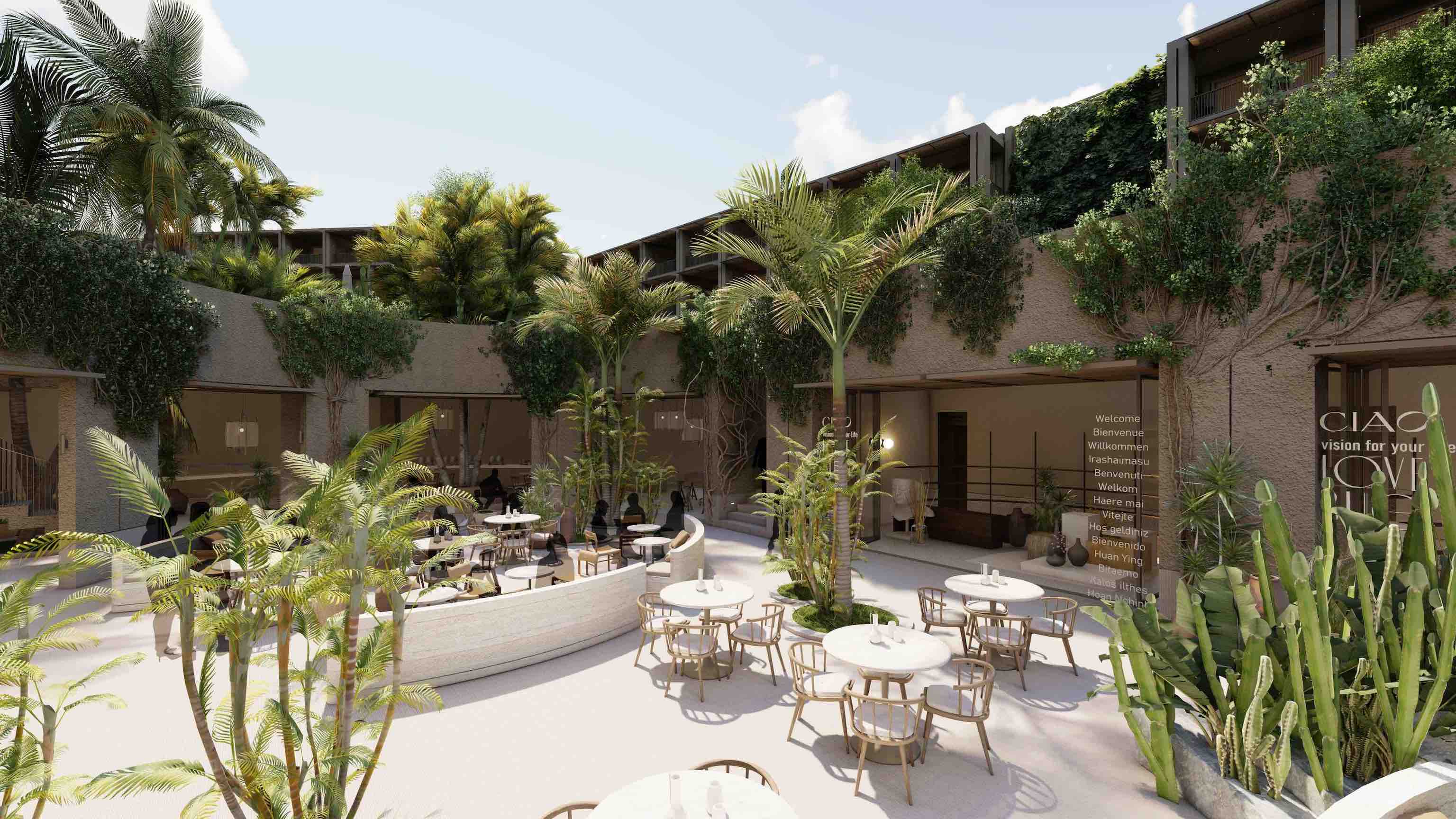 Large courtyard with palm trees, plants, small white round tables and wooden chairs, and large open windows on a beige building