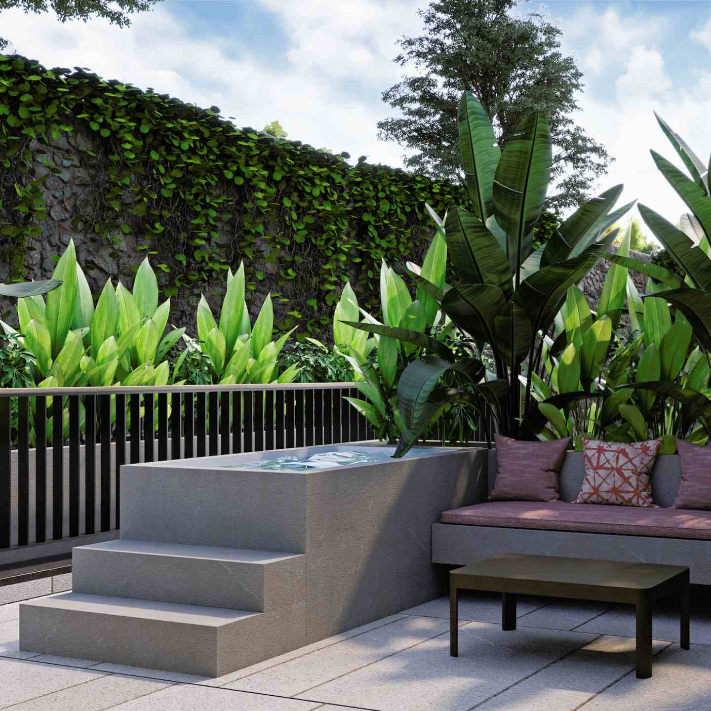 Stone jacuzzi with large green plants in the background and a red cushioned outdoor sofa