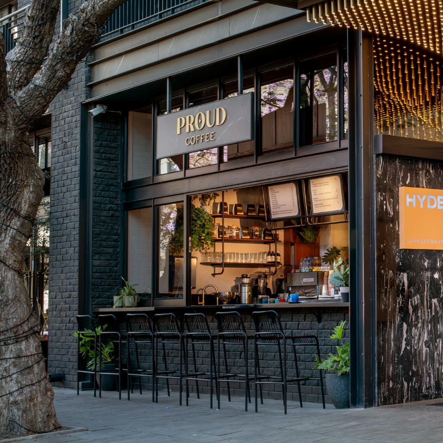 Proud Mary coffee station set with black bar stools placed on the outside.