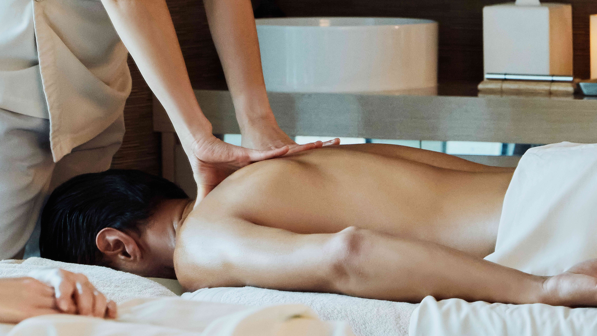 Lady getting a back massage in the spa